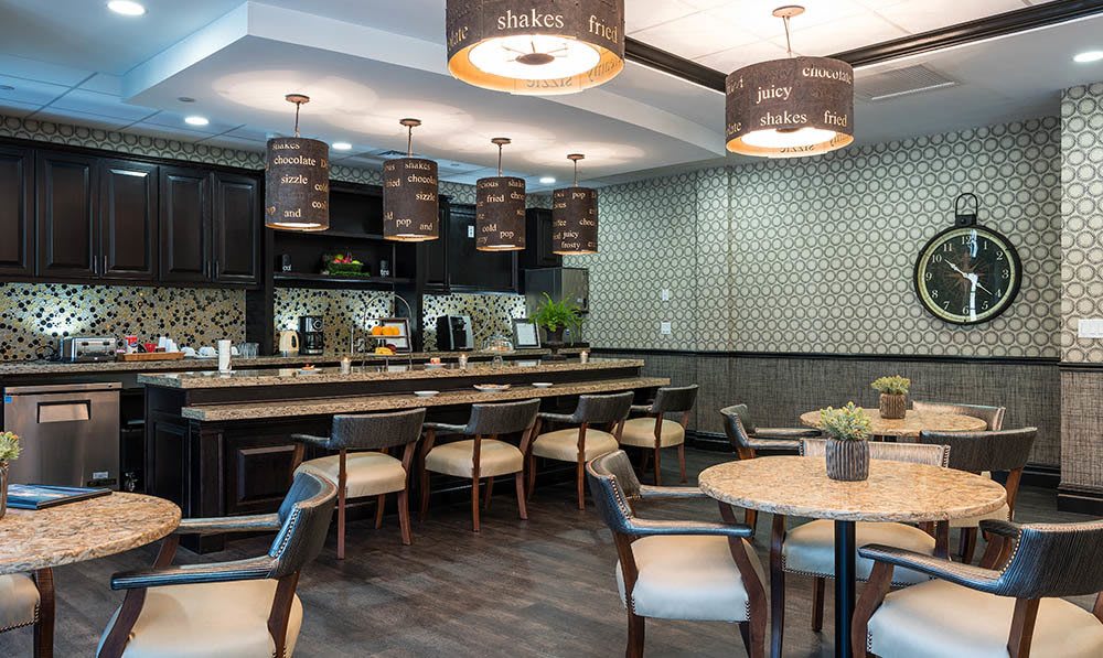A view of the tables, chairs and main counter setup in the Five Corners Bistro at The Ambassador