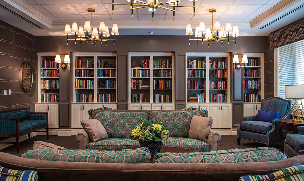 View of the couch and bookshelves in the Popham Library at The Ambassador