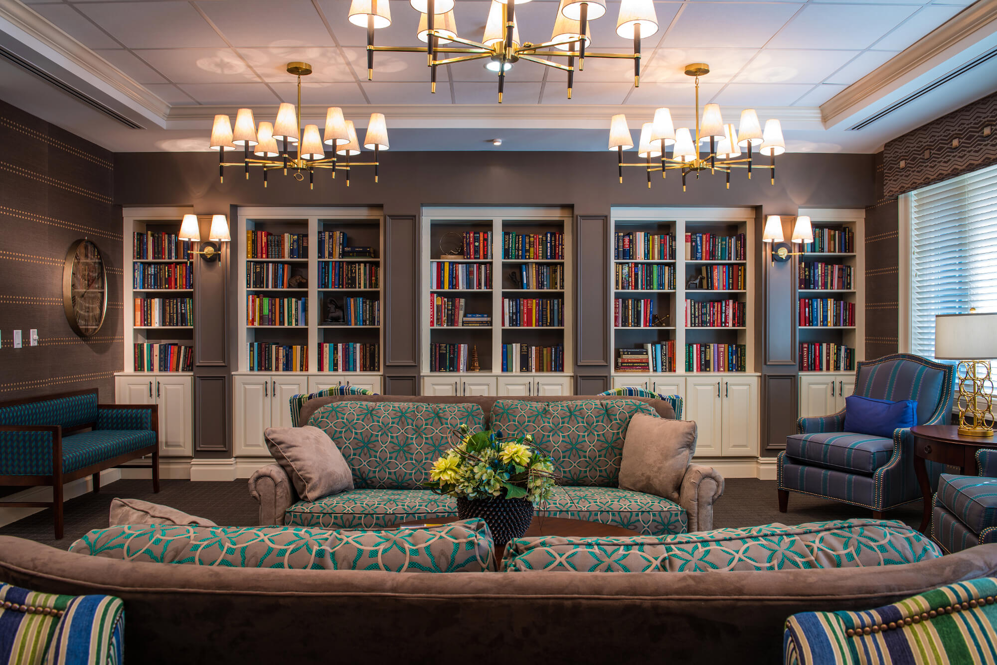 View of the couch and bookshelves in the Popham Library at The Ambassador