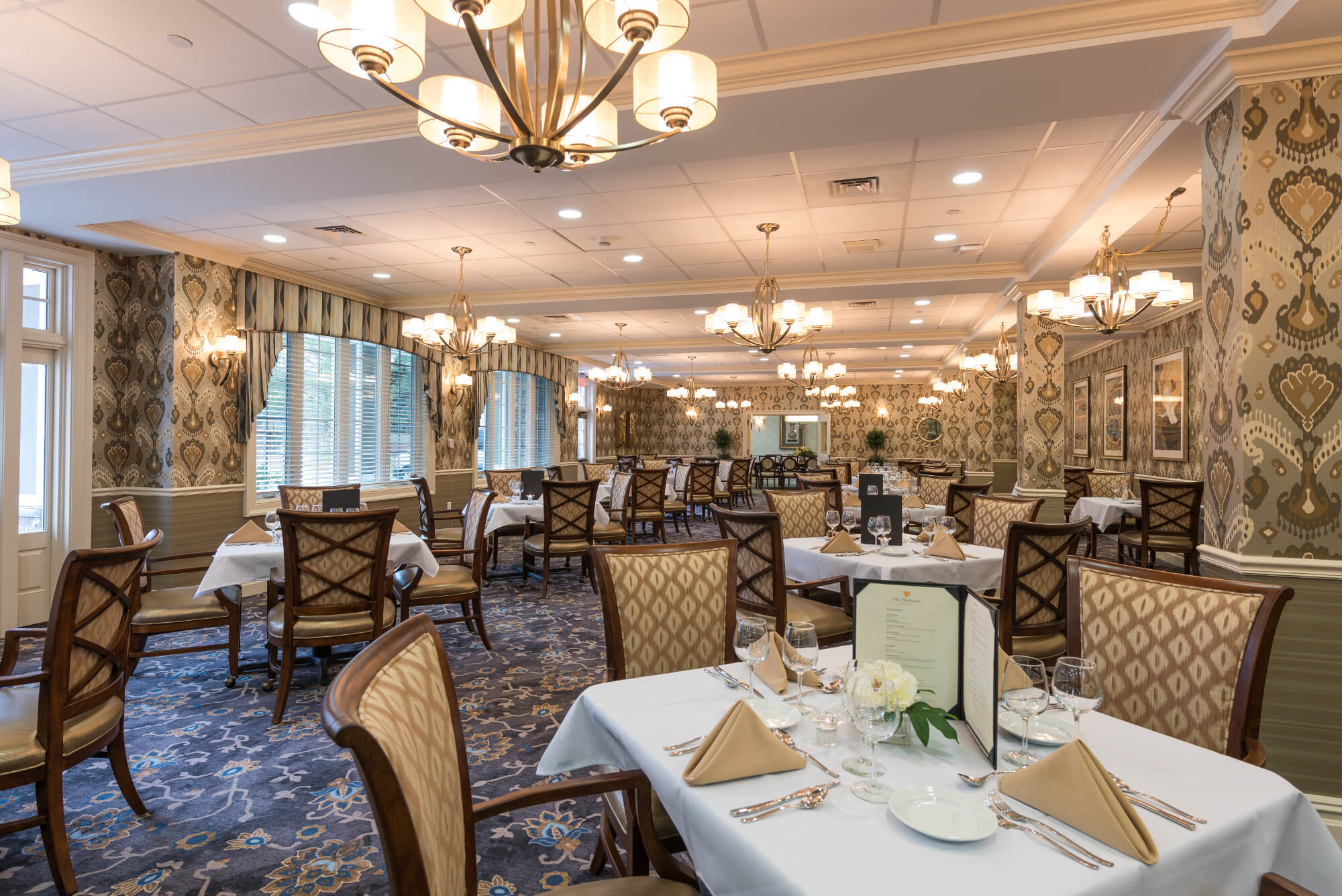 Elegant table and chair setup in the Heathcote Dining Room at The Ambassador